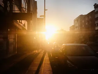 Narrow street glowing in the light of the setting sun